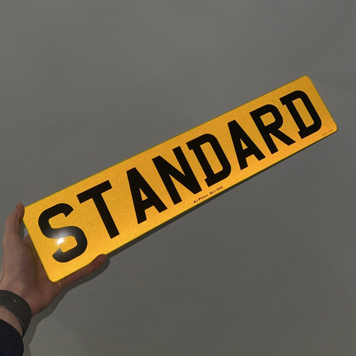 2D number plate under flash showing road-legal reflective backing